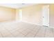 Large, open living room featuring tiled floors and neutral walls at 98 Pinata Ct, Kissimmee, FL 34743