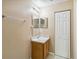 Neutral bathroom featuring vanity with white countertop and wood cabinets at 1002 Chalcedony St, Kissimmee, FL 34744