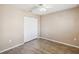 Bedroom features modern ceiling fan and closet with bi-fold doors at 1002 Chalcedony St, Kissimmee, FL 34744