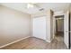 Bedroom featuring modern ceiling fan and closet with bi-fold doors at 1002 Chalcedony St, Kissimmee, FL 34744