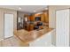 Well-lit kitchen featuring stainless steel appliances, wood cabinetry, and a breakfast bar at 1002 Chalcedony St, Kissimmee, FL 34744