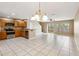 Spacious kitchen featuring wood cabinetry, stainless steel appliances, and an open floor plan at 1002 Chalcedony St, Kissimmee, FL 34744