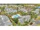 Overhead shot of an apartment complex featuring lush landscaping and an inviting community pool at 1065 S Hiawassee Rd # 1425, Orlando, FL 32835