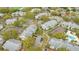 Detailed aerial of a residential area with tennis courts and pool nestled among manicured grounds at 1065 S Hiawassee Rd # 1425, Orlando, FL 32835