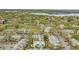 Scenic aerial view of a residential complex with lake, lush trees, and ample parking at 1065 S Hiawassee Rd # 1425, Orlando, FL 32835
