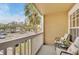Relaxing balcony with seating offers a view of the community and nearby parking at 1065 S Hiawassee Rd # 1425, Orlando, FL 32835