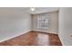 Bedroom featuring wood floors, a ceiling fan, and a large window at 1065 S Hiawassee Rd # 1425, Orlando, FL 32835