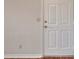 Neutral entryway with a white door and wood flooring, ready for personal touches at 1065 S Hiawassee Rd # 1425, Orlando, FL 32835