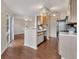 Open kitchen layout with breakfast bar and modern black appliances seamlessly flowing into the living area at 1065 S Hiawassee Rd # 1425, Orlando, FL 32835