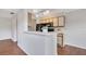 Well-designed kitchen featuring modern appliances, breakfast bar, and ample counter space at 1065 S Hiawassee Rd # 1425, Orlando, FL 32835