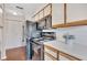 Kitchen view showcasing black appliances, countertops, and laminate flooring at 1065 S Hiawassee Rd # 1425, Orlando, FL 32835