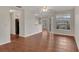 Bright living room features wood floors, large windows, and a contemporary ceiling fan at 1065 S Hiawassee Rd # 1425, Orlando, FL 32835