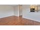 Open living space offers hardwood floors, a closet, and a breakfast bar to the kitchen at 1065 S Hiawassee Rd # 1425, Orlando, FL 32835