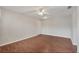 Spacious living room with hardwood floors and a ceiling fan, creating a warm ambiance at 1065 S Hiawassee Rd # 1425, Orlando, FL 32835