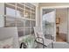 Relaxing patio seating area with chairs, side table and view through the sliding glass door at 1065 S Hiawassee Rd # 1425, Orlando, FL 32835