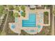 Overhead view of a clean pool with lounge chairs and palm trees around the pool area at 1065 S Hiawassee Rd # 1425, Orlando, FL 32835