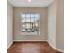 Well-lit room with wood floors and a large window offering pleasant views at 1065 S Hiawassee Rd # 1425, Orlando, FL 32835