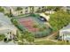 Aerial view of a well-maintained tennis court, surrounded by lush greenery and residential buildings at 1065 S Hiawassee Rd # 1425, Orlando, FL 32835