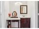 Bathroom featuring wooden vanity, oval mirror and stylish decorations at 115 Anzio Dr, Kissimmee, FL 34758