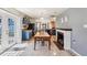 Open dining area featuring a dining table, fireplace, with access to the kitchen at 115 Anzio Dr, Kissimmee, FL 34758