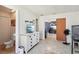 Bright hallway features tile floors, leading to living area and bathroom for flexible living and easy access at 115 Anzio Dr, Kissimmee, FL 34758