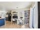Living area with desk, bookshelf, access to kitchen and a glass blocked window at 115 Anzio Dr, Kissimmee, FL 34758