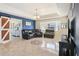 Bright and airy living room features a bay window, tile floors, and stylish furnishings at 115 Anzio Dr, Kissimmee, FL 34758