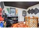 Stylish room setup with hardwood floors, sports memorabilia, and a modern gaming chair at 115 Anzio Dr, Kissimmee, FL 34758