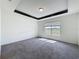 Neutral carpeted bedroom with white walls features a window that provides great light at 119 Summerlin Loop, Haines City, FL 33844