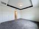 Spacious bedroom with modern tray ceiling, neutral walls, and lots of natural light at 119 Summerlin Loop, Haines City, FL 33844