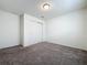 Neutral bedroom features neutral carpeting and a sliding-door closet for convenience at 119 Summerlin Loop, Haines City, FL 33844