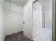Walk-in closet featuring wire shelving, neutral color palette, and lots of storage at 119 Summerlin Loop, Haines City, FL 33844