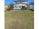 The backyard features a screened in pool and ample space for recreation at 1211 Carey Glen Cir, Orlando, FL 32824