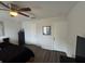 Bright bedroom showcasing wood-like floors and a ceiling fan, creating a welcoming atmosphere at 1211 Carey Glen Cir, Orlando, FL 32824