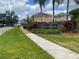 Welcoming Heather Glen neighborhood sign amidst lush landscaping and mature palm trees at 1211 Carey Glen Cir, Orlando, FL 32824