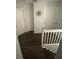 A well-lit upstairs hallway with wood floors and white doors leading to various rooms at 1211 Carey Glen Cir, Orlando, FL 32824