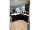 Well-equipped kitchen with dark cabinets, white countertops, a sink, and a breakfast bar at 1211 Carey Glen Cir, Orlando, FL 32824