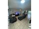 Bright living room featuring tile flooring, ceiling fan, and cozy seating arrangements at 1211 Carey Glen Cir, Orlando, FL 32824