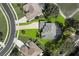 Aerial view of a home showcasing its pool, surrounding landscaping, and neighborhood layout at 13044 Lakeshore Grove Dr, Winter Garden, FL 34787