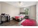 Cozy bedroom with natural light, wood-look flooring, ceiling fan, and closet at 13044 Lakeshore Grove Dr, Winter Garden, FL 34787