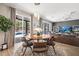 Modern dining area showcases stylish lighting, a sliding glass door, and an elegant rug at 13044 Lakeshore Grove Dr, Winter Garden, FL 34787