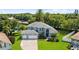 Beautiful two-story home with a three-car garage, lush landscaping, and well-manicured lawn at 13044 Lakeshore Grove Dr, Winter Garden, FL 34787
