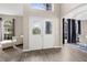 Bright foyer featuring a double door entry with decorative glass and hardwood floors at 13044 Lakeshore Grove Dr, Winter Garden, FL 34787