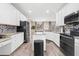 Beautiful kitchen with white cabinets, granite countertops and stainless steel appliances at 13044 Lakeshore Grove Dr, Winter Garden, FL 34787
