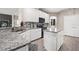 Bright kitchen with white cabinets, granite countertops, and stainless steel appliances at 13044 Lakeshore Grove Dr, Winter Garden, FL 34787