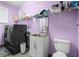Functional laundry room with modern washer, dryer, sink, and ample storage on shelving at 13044 Lakeshore Grove Dr, Winter Garden, FL 34787