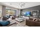 Bright living room with large sliding glass doors leading to an outdoor patio at 13044 Lakeshore Grove Dr, Winter Garden, FL 34787