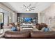 Bright and airy living room features neutral walls, comfortable seating, and abundant natural light at 13044 Lakeshore Grove Dr, Winter Garden, FL 34787