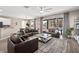 Open living area with a view of the outdoor pool and patio area at 13044 Lakeshore Grove Dr, Winter Garden, FL 34787