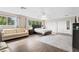 Spacious main bedroom featuring neutral walls, wood-look floors, and ample natural light at 13044 Lakeshore Grove Dr, Winter Garden, FL 34787